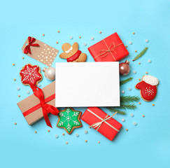 Obraz premium Flat lay composition with Christmas decor on blue background