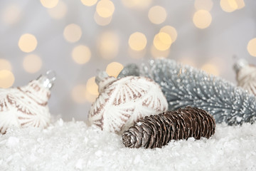 Fototapeta na wymiar Christmas decoration on snow against blurred background