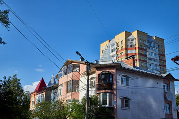 Facade of building with flats and offices and sky background