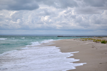 seascape wave beach sand clouds