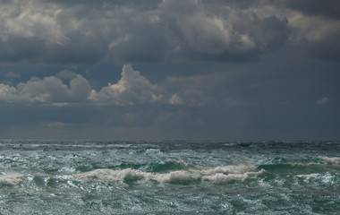 Fototapeta na wymiar seascape wave beach sand clouds