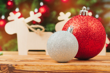 Christmas fur-tree decorations on wooden table close up