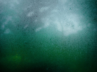Glass texture with water spray for background.