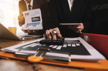 Business team meeting. professional investor working new start up project. Finance task. with smart phone and laptop and digital tablet computer  in morning light