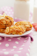 Close up of sweet tiny cookies stacked on a wooden table