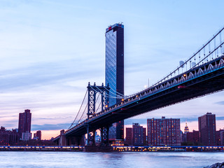 Fototapeta na wymiar View to New York Manhattan at dusk in colorful impression