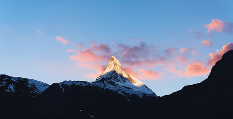 Swiss Alps, Panoramic Matterhorn mountain with sunlight on peak in Switzerland