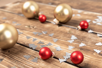 christmas balls red and gold wooden background