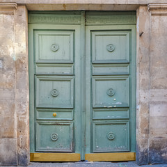 Paris, ancient wooden door in the Marais, typical architecture