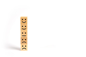 Customer service evaluation and survey concept with wooden block stacked vertically
