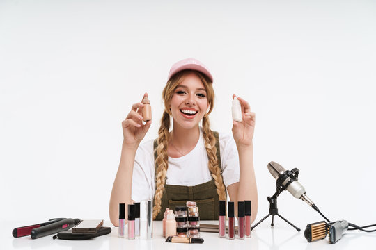 Smiling young blonde girl blogger making a beauty video
