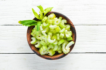 Sliced celery on a white background Wooden. Healthy food. Top view. Free space for your text.