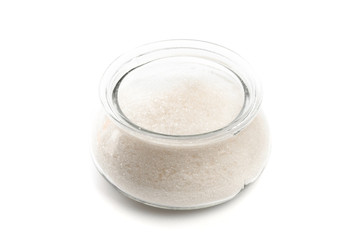 Sugar in  glass bowl on white background  top view