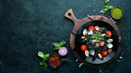 Pasta with seafood. Black paste. Seafood. Top view. Free copy space.
