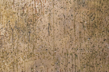 Color abstract painted background splashes of paint on old brown cement wall