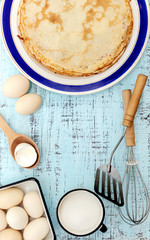 Cooking pancakes. Ingredients, crockery and kitchenware for pancakes.