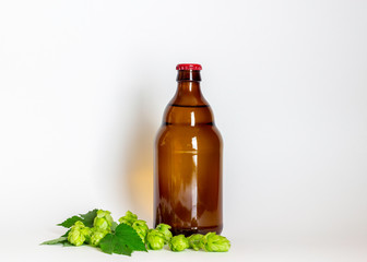 Beer bottle with a red cork on a gray background. Design. Minimalism. Creative idea. Mock-up.