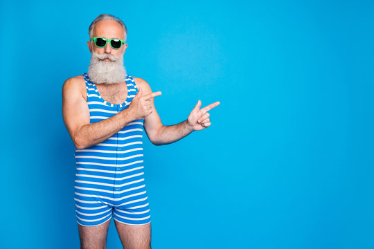 Portrait of nice attractive confident content serious gray-haired man pointing good advice ad advert decision look idea copy space isolated over bright vivid shine turquoise blue background