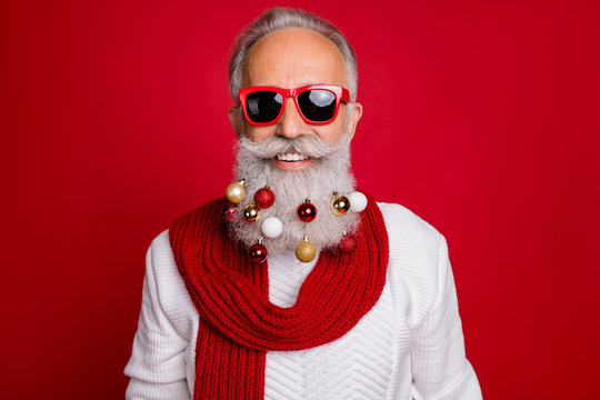 Portrait of cheerful pensioner in eyewear eyeglasses smiling wearing white sweater isolated over red background