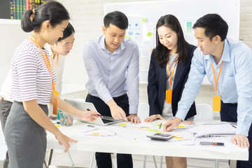 Group of employee worker brainstorm together and use technology together of  tablet and computer laptop, internet lifestyle generation