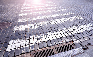 Pedestrian crosswalk on old paving stone