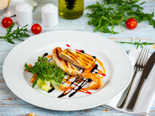 Grilled chicken steak. Grilled chicken breast. Restaurant serving.