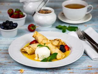 Pancakes with a scoop of ice cream. Restaurant serving.