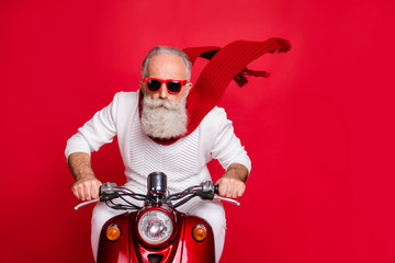 Close up photo of cool pensioner riding his bike with air wind blowing wearing white jumper sweater...