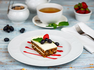 A slice of carrot cake. Restaurant serving.
