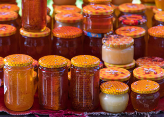 Glass jars with different varieties of honey