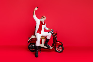 Fototapeta na wymiar Full length body size view of his he nice attractive well-dressed stylish trendy confident cheerful gray-haired man taking making selfie isolated over bright vivid shine red background