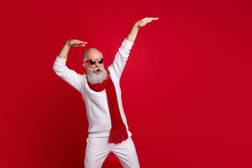 Modern santa character aged man moving like star at party wear sun specs knitted clothes isolated...