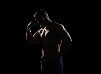 Obraz na płótnie Canvas Image of muscle man posing in studio