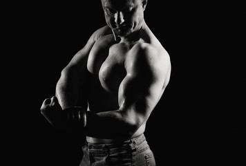 Naklejka na ściany i meble Image of muscle man posing in studio