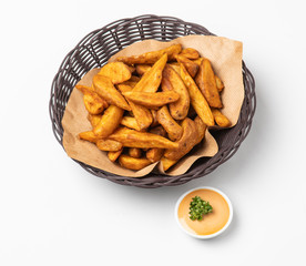 Baked potato wedges with cocktail dip isolated on white background