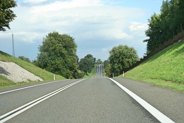 Asphalt road with car. Transport and tourist concept. Poland road background.