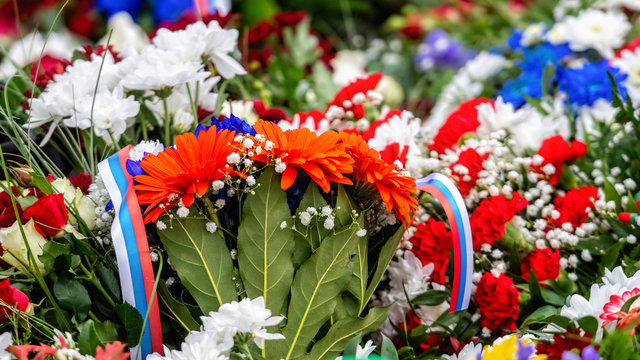 Flower bouquet with ribbon of Russia flag. National Day of the Russian Federation - image