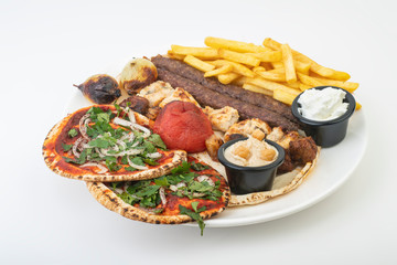 Lebanese Mixed Grill plate isolated on white.