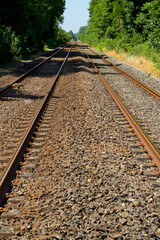 Naklejka premium Railroad tracks on concrete sleepers and ballast bed