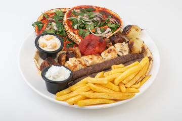 Lebanese Mixed Grill plate isolated on white.