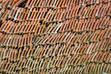 Stack of roof tiles, bricks arranged, full frame