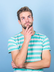 Hard question. Man serious face thoughtful. Have some doubts. Hipster bearded face not sure in something. Thoughtful man on blue background. Thoughtful expression. Need to think. Find solution