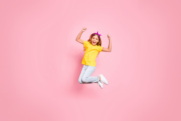 Fototapeta na wymiar Full length body size view of her she nice attractive lovely carefree ecstatic cheerful cheery pre-teen girl wearing yellow t-shirt having fun rejoicing isolated over pink pastel background