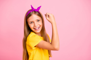 Close-up portrait of her she nice attractive lovely winsome cheerful cheery confident pre-teen girl wearing yellow t-shirt celebrating attainment isolated over pink pastel background