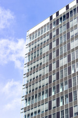 Fototapeta na wymiar Modern office glasses buildings cityscape under blue clear sky.