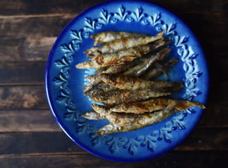 fried fish with crispy crust on a blue plate