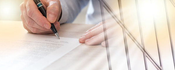 Man signing a contract, light effect; multiple exposure