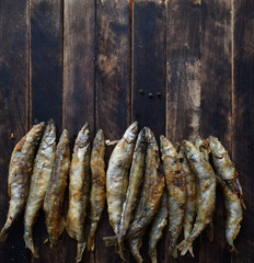 fried battered fish on wooden table top view