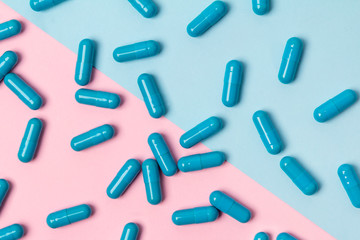 Blue pills at creative background. Medicine concept.
