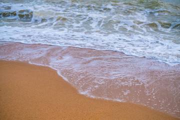 Summer vacation view of the blue sky with beautiful sea. wave ocean on sandy beach. for travel in the holidays. nature background.